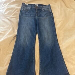 Sneak peek flared mid rise jeans